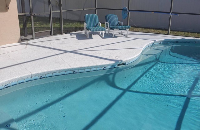 South west facing pool with privacy fence