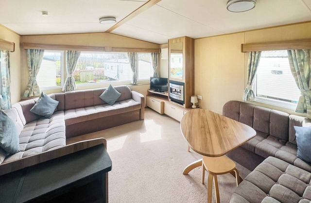 Spacious 12ft-wide family caravan with one double and one twin.