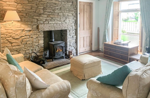 Stone-built double-fronted cottage positioned within the market place of Allendale.