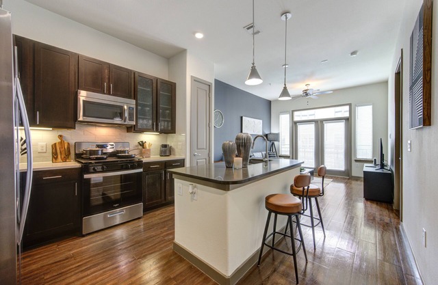 Stunning 1bd suite with warm and bold interiors, great amenities, & a pool view.