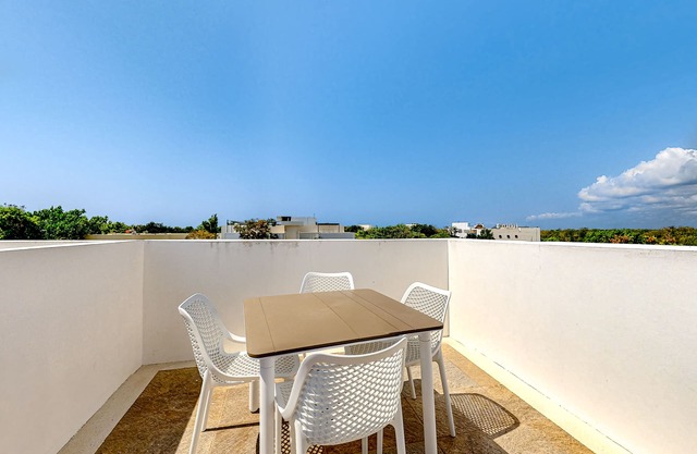 Stylish studio near beach with rooftop pool, partial AC, & free WiFi