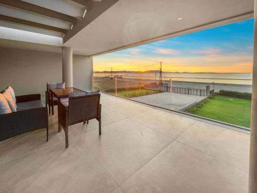 Sun and Sea Apartment - Beachfront, 2 Bedrooms with Sea View & Garden