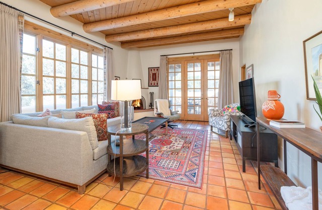 Sun-soaked stay with community amenities, fireplace, grill, & al fresco dining