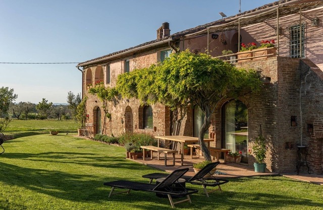 Sunlit Tuscan Farmhouse with a Lush Garden