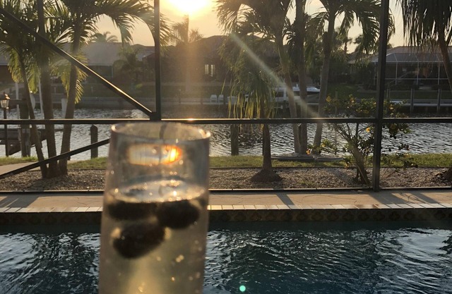 Sunset lit sky over private pool lanai! Walk 2 town & all around! PRIME LOCATION