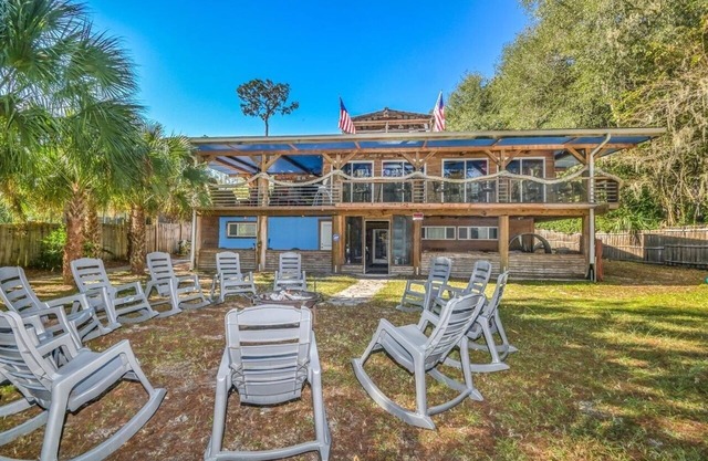 SUPER SIZED 3 STORY RIVERFRONT LODGE WITH UNIQUE VIBES. EVERYTHING INCLUDED!