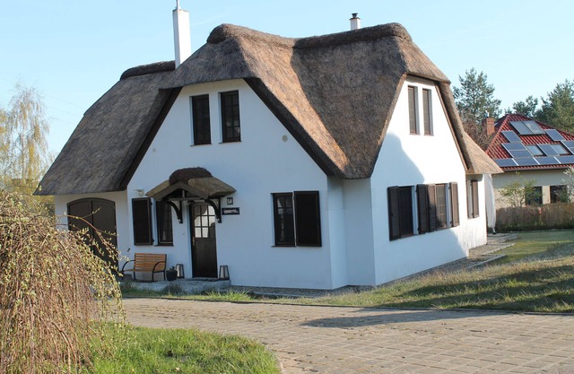 Thatched cottage on Woliner National Park overlooking the Neuendorfer See