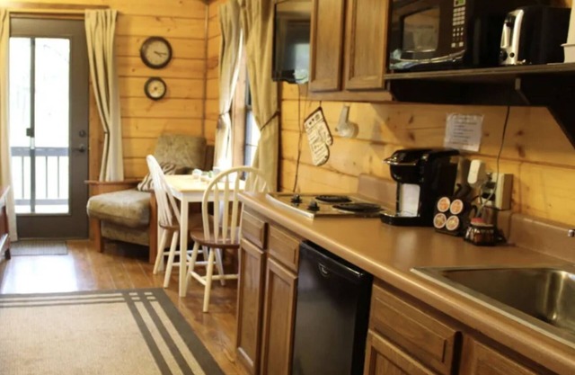 The hideaway retreat cabin has views of open fields and sweet water lake.