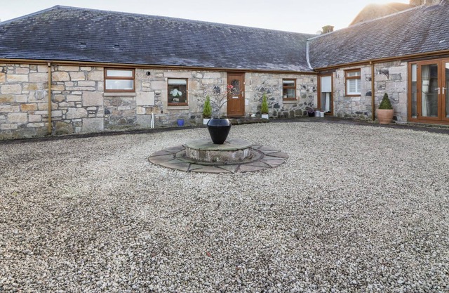 THE KIRKLANDS COTTAGE, with a garden in Eaglesham, Glasgow