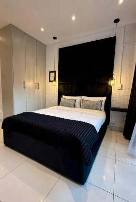 The Monochrome Apartment 209 - Urban Chic Escape - Open Plan Bathroom with Bathtub