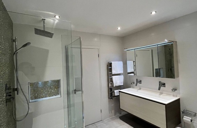 This luxurious home features an outdoor gym, hot tub, BBQ area and cinema room.n