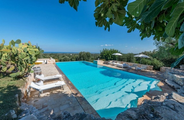 Trulli complex with luxurious infinity pool overlooking the sea