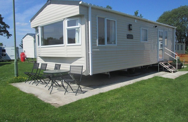 Two bedroom caravan sleeping 4 people with one double and one twin room.