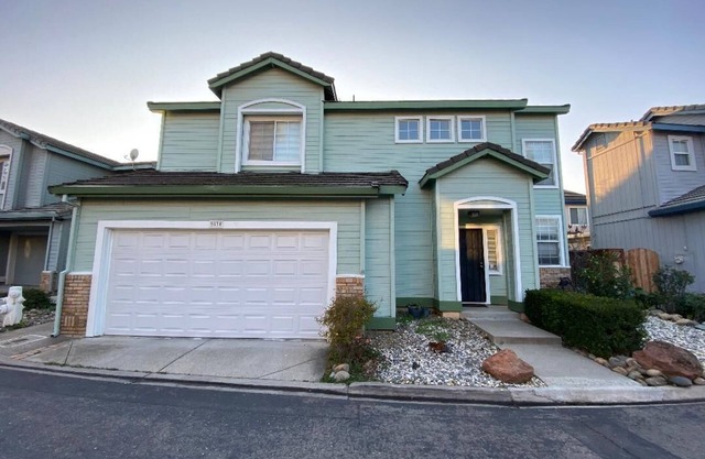 Updated home with garage parking near shopping, parks, and freeways