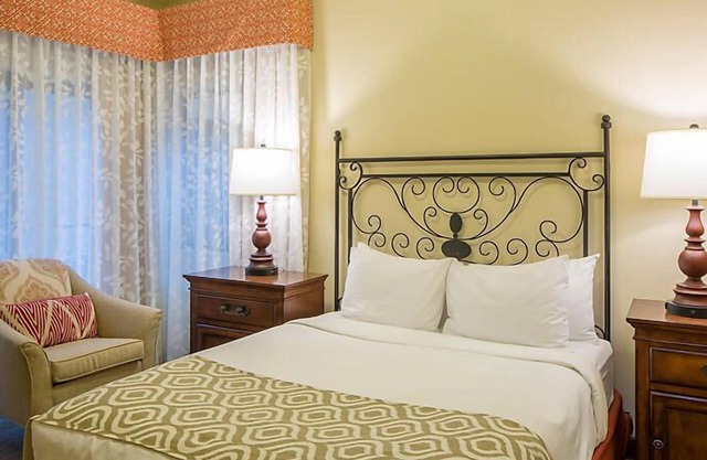 UpScale Resort with Outdoor Heated Pool with a waterslide and a poolside bar, tennis court and gym