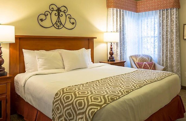 UpScale Resort with Outdoor Heated Pool with a waterslide and a poolside bar, tennis court and gym