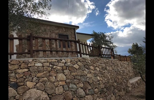 VILLA in Sardinian stone surrounded by greenery. Panoramic terrace, BBQ and relaxation area