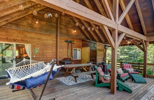 Vintage dog-friendly riverfront cabin with covered deck & fireplace - near lake