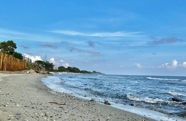 Waterfront apartment with pool and private beach access.