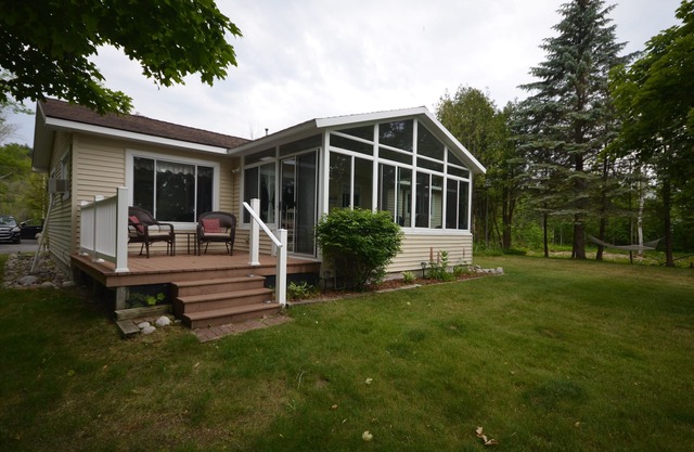 Waterfront home Lake Leelanau. Enclosed porch, WIFI. Canoe, row boat Dog ok.