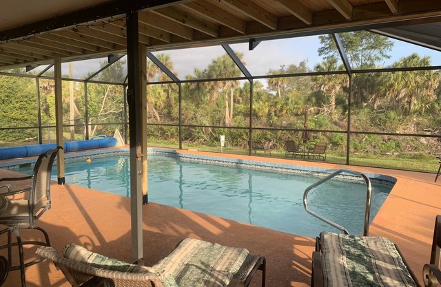 Waterfront single home rental with private lanai, heated pool, and hot tub!
