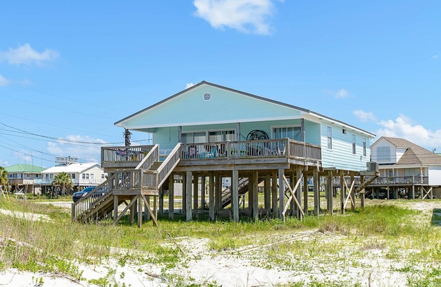 Welcoming home with WiFi, gulf views & spacious deck - steps to the beach