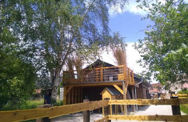 Wooden Chalet with Private Garden, Hot Tub, and Parking in Charming Village