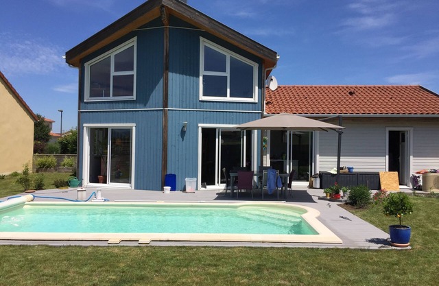 Wooden house with swimming pool