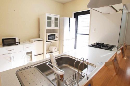 Amami Apartment | ゲストハウス凪人