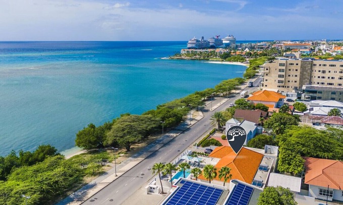 Oranjestad Villa | 10BR Luxe Beachfront Pool Villa Playa by Bocobay