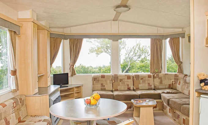 Looe House | 12ft-wide caravan with one double and one twin.