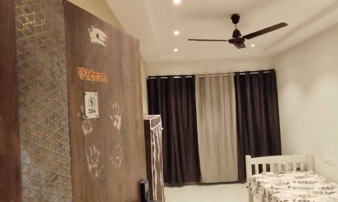 Kharghar Apartment | 1BHK flat fully furnished bedroom, hallway with single bed balconies.