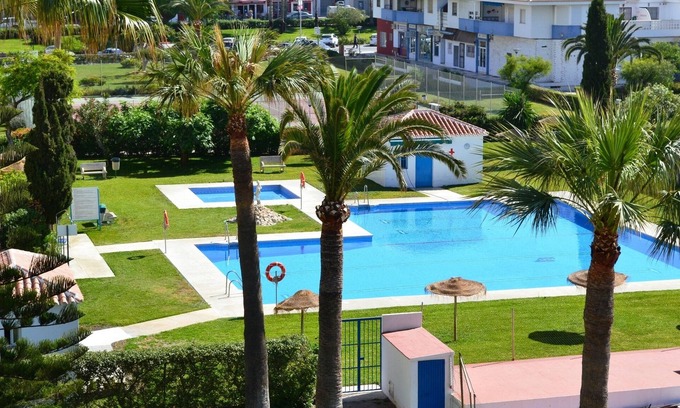Torrox Costa Apartment | 25 metres to the beach, great sea view and overlooking beautiful pool & gardens