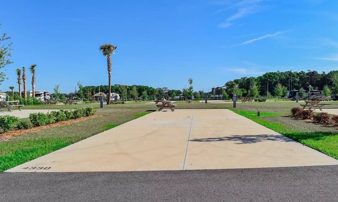 Fellowship RV Rental | 70' RV Pad at Champion's Run Luxury RV Resort with full hookups