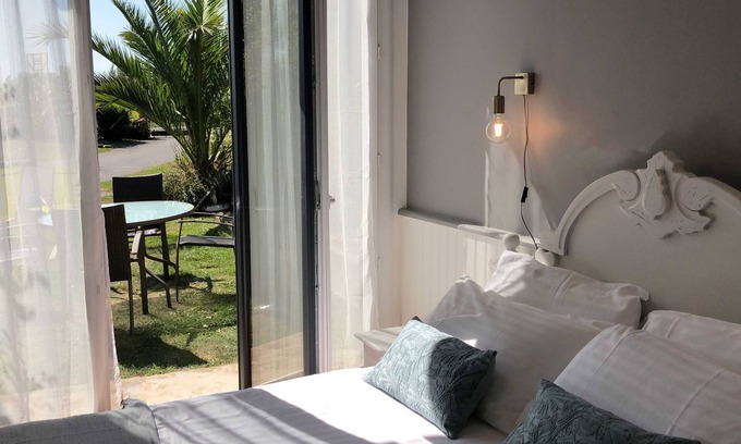 Henansal Cottage | A 2 bedroom gite sleeping 4 plus a cot with access to a heated covered pool.