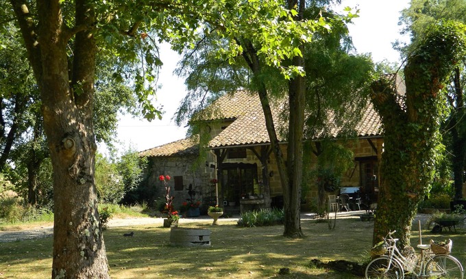 Puymiclan House | A 200 year old house attached to an 11th century water mill in peaceful gardens.