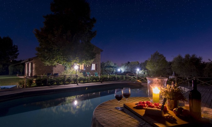 Torgiano Villa | A farmhouse nestled among gardens and olive trees