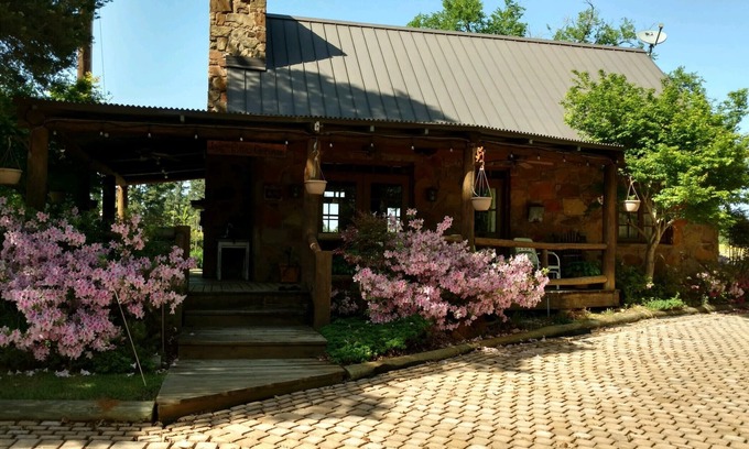 Palestine Cottage | A rustic stone cottage on an estate close to the Texas State Railroad.