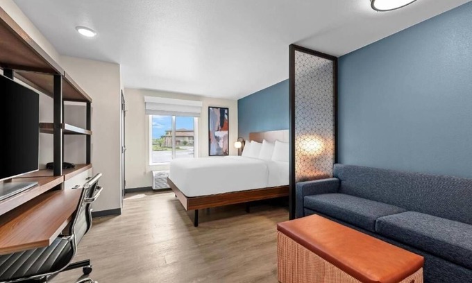 Brownsville Hotel | Accommodates 3 Suites | King Bed + Kitchen & Sofa