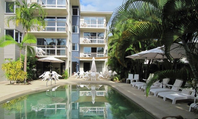 Nelly Bay Apartment | Across from beach! Wake up to beautiful sunrises, lush greenery & passing boats