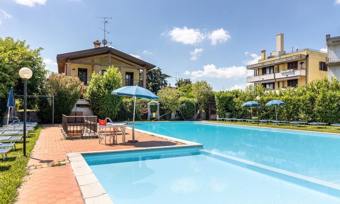Desenzano del Garda Apartment | Apartment 'Casa Cattaleya' with Shared Pool, Private Terrace and Shared Garden