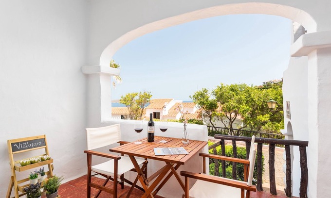 Platges de Fornells Apartment | Apartment 'Vistafaro' with Sea View, Shared Pool and Wi-Fi