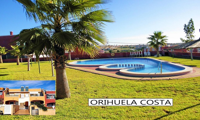 Orihuela Costa Apartment | Apartment with Large Roof Solarium, Pool, Garden, Barbecue, A/C & Wi-Fi