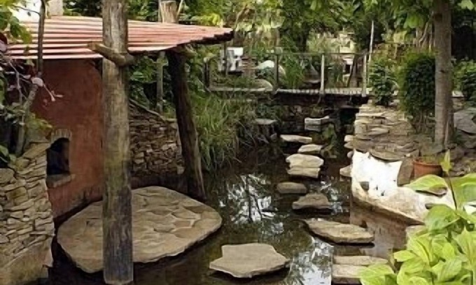 Clonaslee Cottage | Architectural house from local wood and stone. Featured garden in Slieve Blooms.