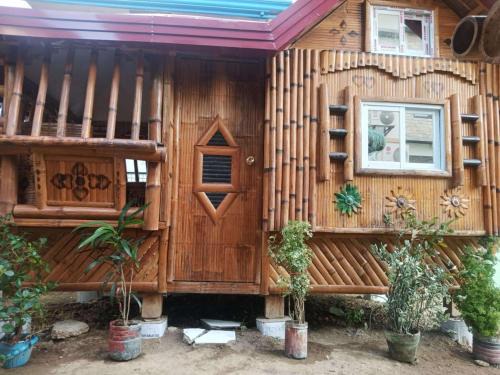 San Juan Bed & Breakfast | Aremen Transient, Nipa Hut with shared main houses bathroom