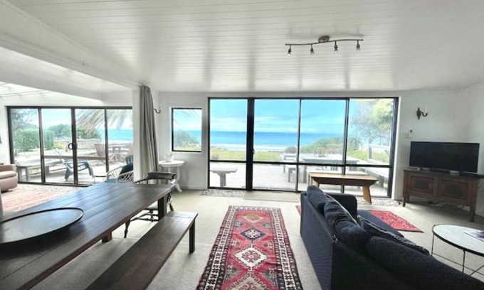 Wainui House | Awesome Wainui Spacious Holiday Home Overlooking the Surf - no pets.