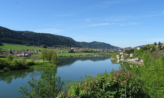 Villers-le-Lac Apartment | "Balcony overlooking the Doubs Basin and the Swiss village of Les Brenets