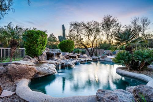Desert View Village House | Barwick is a private oasis Practice on the putting green shoot pool and enjoy this city getaway.