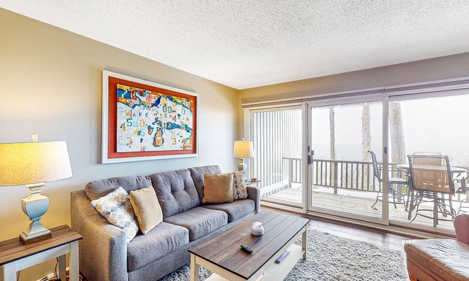 Maple City Condo | Bayfront condo with lake & bay views, deck, 2 fireplaces, private washer/dryer