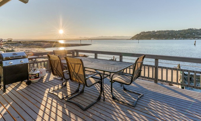 Clinton House | Bayfront home with views, WiFi, cable, patio and wood-burning fireplace